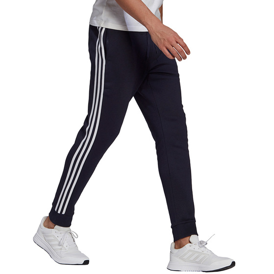 Spodnie męskie adidas Essentials Fleece Tapered Cuff 3-Band Pants granatowe GK8823